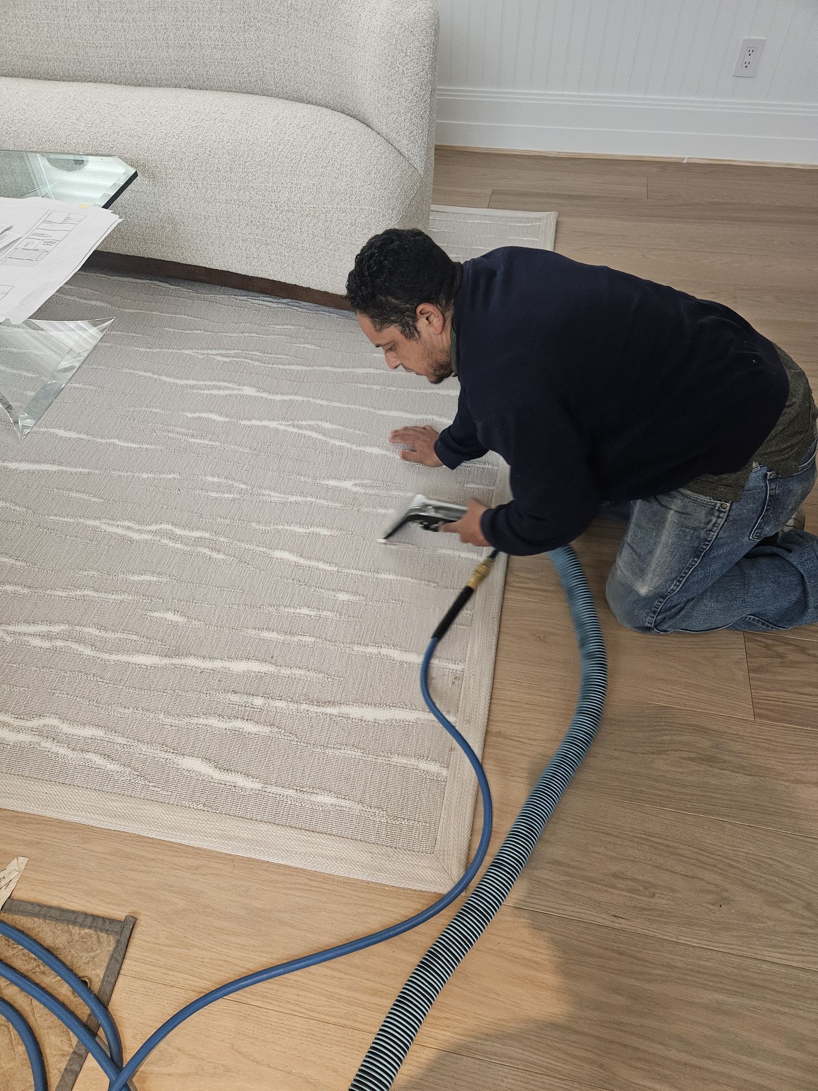 Green Choice technician cleaning an area rug on-site in Levittown NY